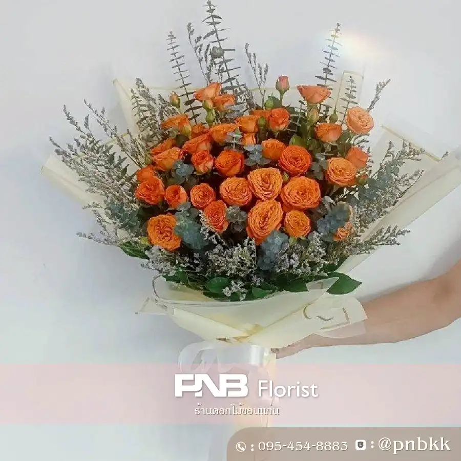 ภาพส่งจริง ช่อกุหลาบสีส้ม ห่อทอง พรีเมียม (Golden Orange) - ช่อใหญ่ ณ โรงเรียนเทศบาลบ้านเป็ด